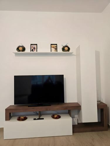 TV a/nebo společenská místnost v ubytování Appartamento Denis