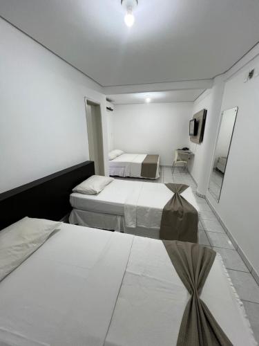 Katil atau katil-katil dalam bilik di Águas Palace Hotel