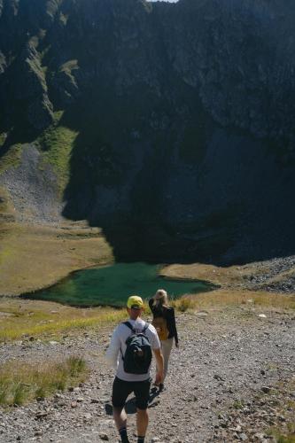 a man and a woman walking down a mountain path at Eckis Appartements in Schruns