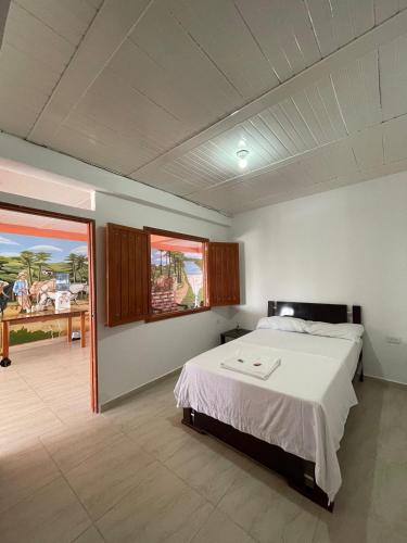 Postel nebo postele na pokoji v ubytování Hotel Marquez