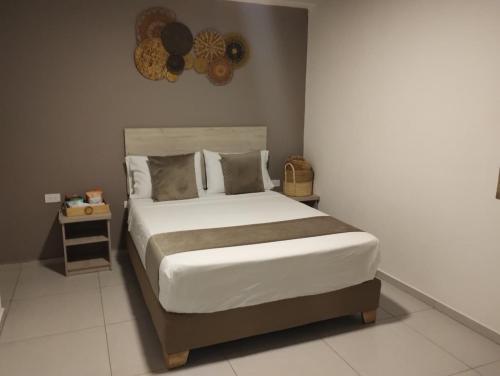 Postel nebo postele na pokoji v ubytování Hotel Med Llanogrande
