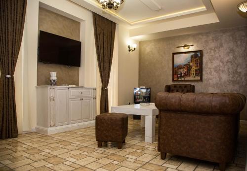 TV a/nebo společenská místnost v ubytování RussoHotel