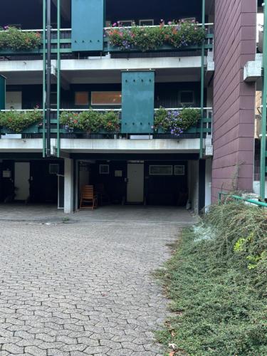 a building with a balcony with plants on it at Apartment im Sasbachwalden Schwarzwald in Sasbachwalden