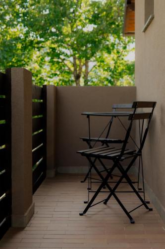 a table and a chair on a balcony at O'Toole's, Plitvice in Korenica
