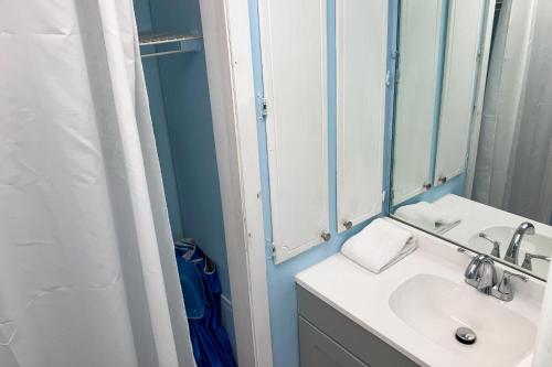 a bathroom with a sink and a mirror at Fontainebleau 305 in Panama City Beach