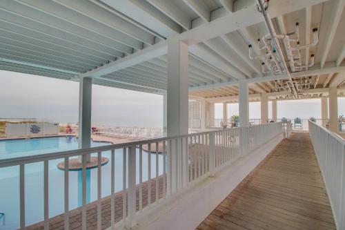 a view of the pool from the balcony of a resort at Fontainebleau 305 in Panama City Beach