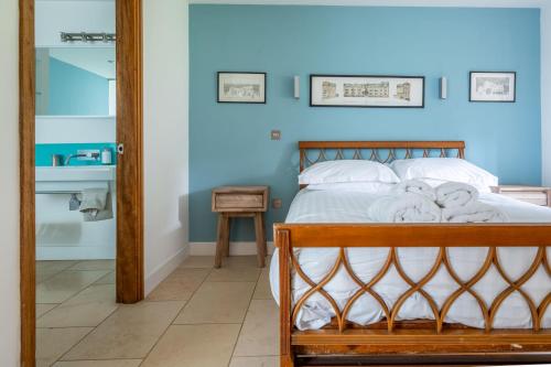 a bedroom with a bed with towels on it at Sedum House 8 in Gimingham