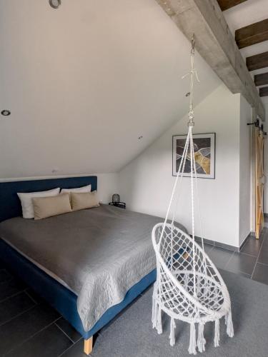 a bedroom with a bed with a swing at O'Toole's, Plitvice in Korenica