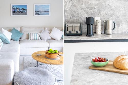a living room with a couch and a table with a bowl of fruit at Neathercoat in Wells next the Sea