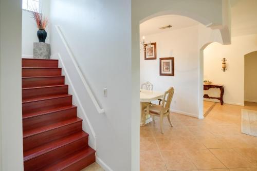 a staircase in a home with a dining room and a table at 5 Mi to Boating! Port St Lucie Home with Backyard in Carlton