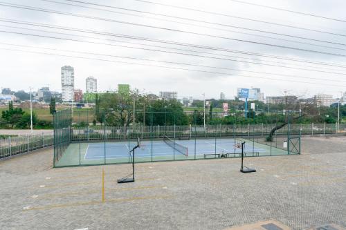 a tennis court in a parking lot at Signature View Apartment in Accra