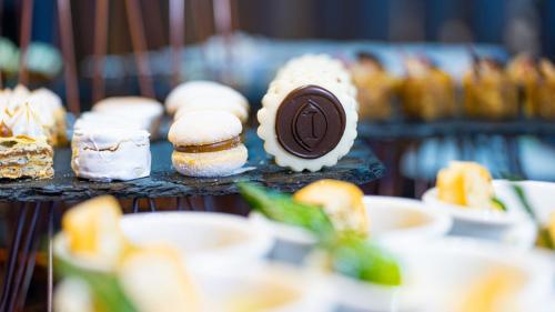 a bunch of pastries on a tray with a chocolate bar at InterContinental Santiago by IHG in Santiago