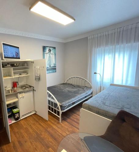 a room with two beds and a bunk bed at Ferienwohnung-Oberstein im Zentrum in Idar-Oberstein