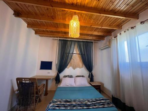 En eller flere senge i et værelse på Cozy House