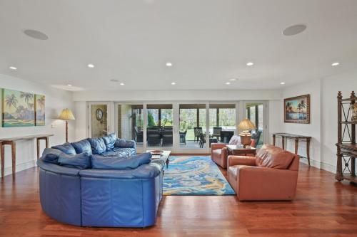 a living room with two blue couches and a living room at Chilmark Luxury Quansoo Beach Access-4br in West Tisbury