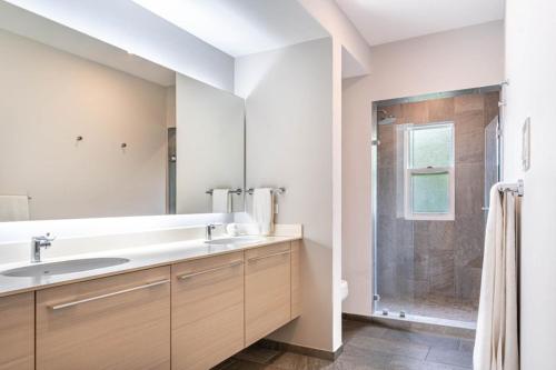 a white bathroom with a sink and a shower at Uvita Paradise , Walk to the Ballena Beach in Uvita