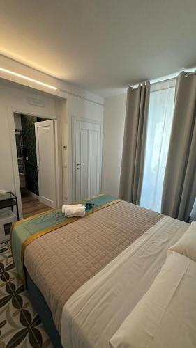 Ένα ή περισσότερα κρεβάτια σε δωμάτιο στο B&B La Torre