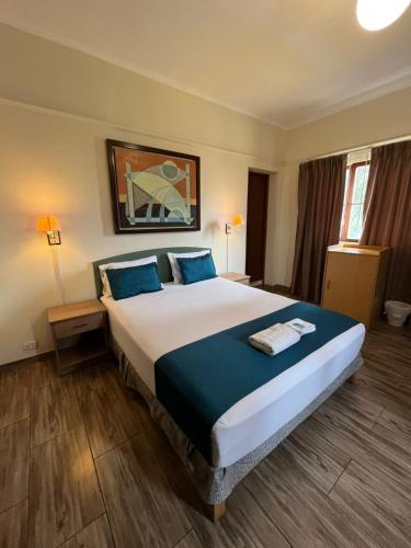 Postel nebo postele na pokoji v ubytování Hotel San Isidro Inn