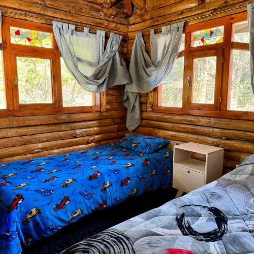 Giường trong phòng chung tại Alojamientos Titin