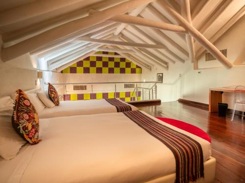 Postel nebo postele na pokoji v ubytování Casa Cartagena Boutique Hotel & Spa