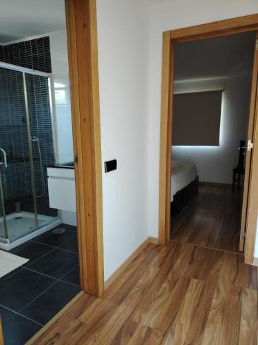 a room with a door leading to a bedroom at Casa das Pedras in Vieira do Minho
