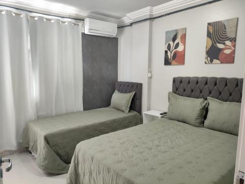 Ένα ή περισσότερα κρεβάτια σε δωμάτιο στο Gran Palazzo Pajuçara - Apartamento 04 quartos beira mar!