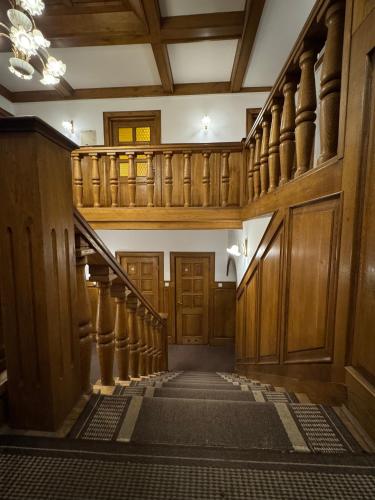 an image of a hallway with stairs in a building at Hotel Familiar in Kobyłka