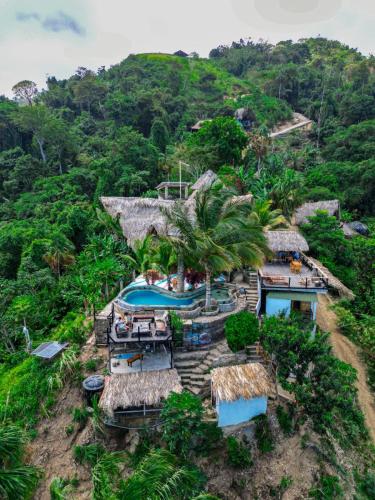 an aerial view of a resort with a swimming pool at Puerto Alto Hostel in Santa Marta