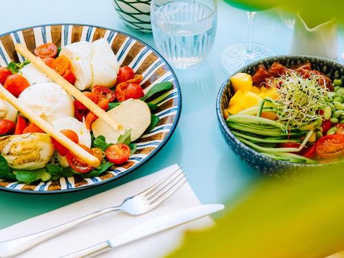 a table with two bowls of food on a table at Mondrian Cannes in Cannes