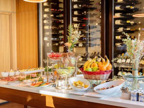 a buffet of food and fruit on a table at Mondrian Cannes in Cannes