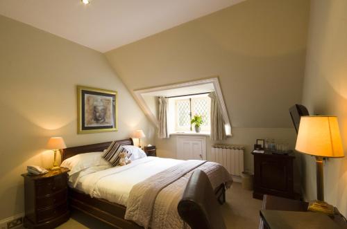 a bedroom with a large bed and a window at Chateau La Chaire in Rozel