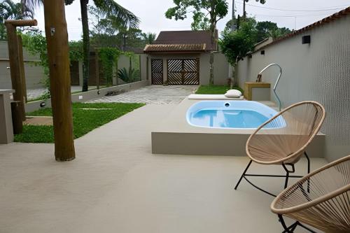 Πισίνα στο ή κοντά στο Casa com piscina privativa, 4 minutos da praia