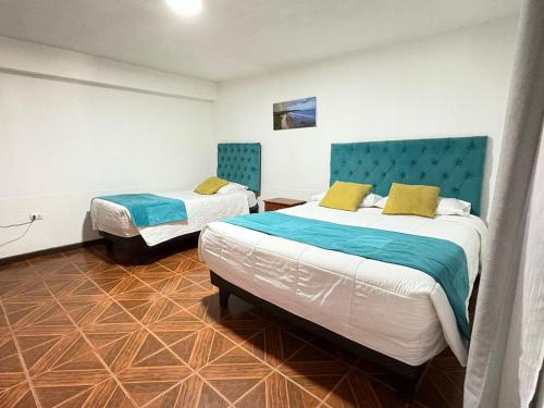 Postel nebo postele na pokoji v ubytování Hostal CECIL +