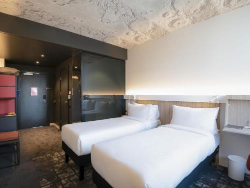Postel nebo postele na pokoji v ubytování ibis Baku City