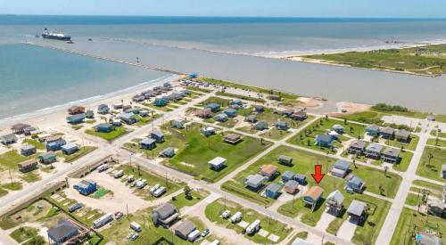 an aerial view of a parking lot next to the water at Sweet Caroline by the Coast - Short Walk to the Beach or Jetty Park in Surfside Beach