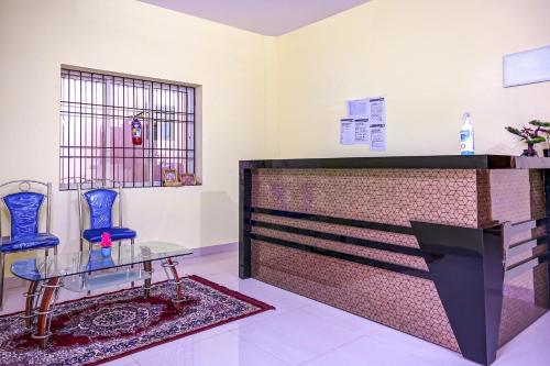 Postel nebo postele na pokoji v ubytování Hotel O Sarala Residency