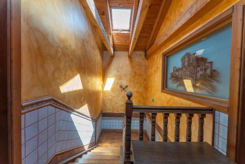 a hallway with a staircase in a house at Hotel Rincón Castellano in Cuéllar