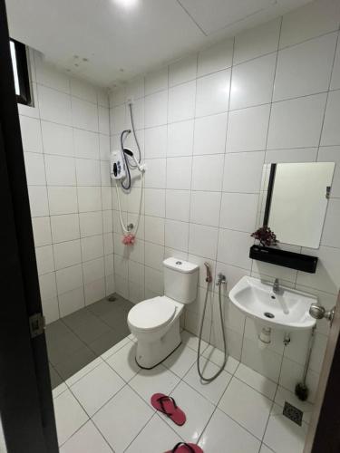 a bathroom with a shower and a toilet and a sink at I&M Staycation in Alor Setar