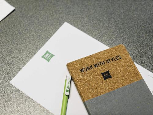a notebook with work miracles written on it next to a pen at ibis Styles Nancy Laxou in Nancy