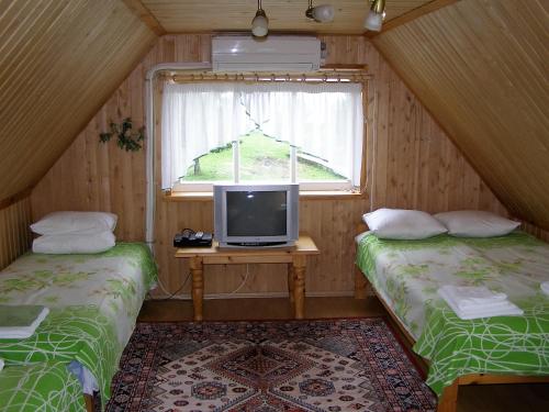 Säng eller sängar i ett rum på Treimani Puhkemaja