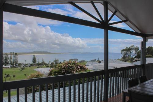 a view of the water from the porch of a house at Perfect Break whole house in Crescent Head