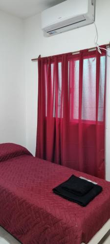 Postel nebo postele na pokoji v ubytování La Perla