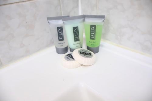 a group of three products sitting on a bathroom counter at The Park Motel in Charters Towers