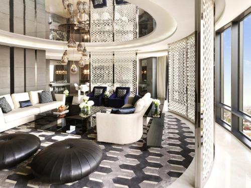 a living room with couches and a table at Fairmont Riyadh in Riyadh