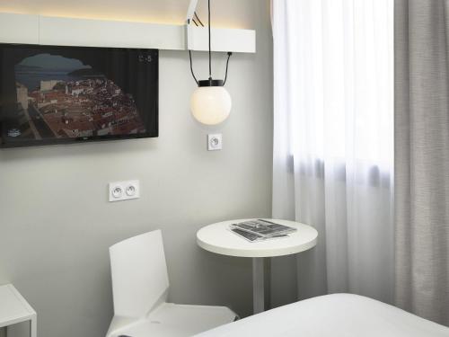 Кровать или кровати в номере Ibis Annecy - Cran-Gevrier