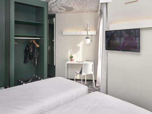 Кровать или кровати в номере Ibis Annecy - Cran-Gevrier