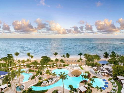 an aerial view of a resort with two pools at Fairmont El San Juan Hotel in San Juan