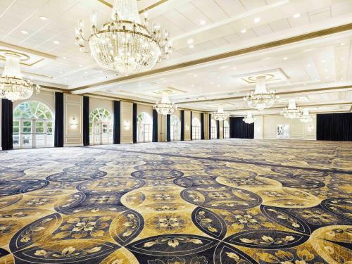 an empty ballroom with a large dance floor at Fairmont El San Juan Hotel in San Juan