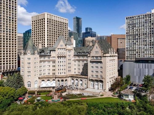 a large white building in the middle of a city at Fairmont Hotel Macdonald in Edmonton