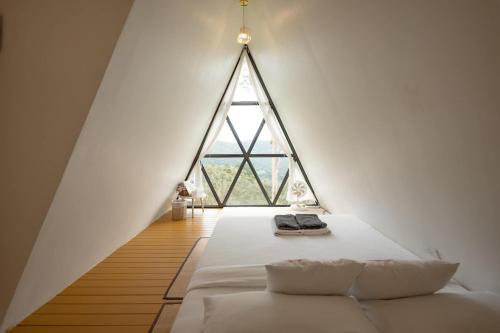 Postel nebo postele na pokoji v ubytování Morning Cloud - Chiang Mai